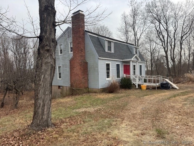 38 High St, Middlefield, CT 06455 - dutch colonial featuring a shingled roof, a chimney, a wooden deck, and a front lawn