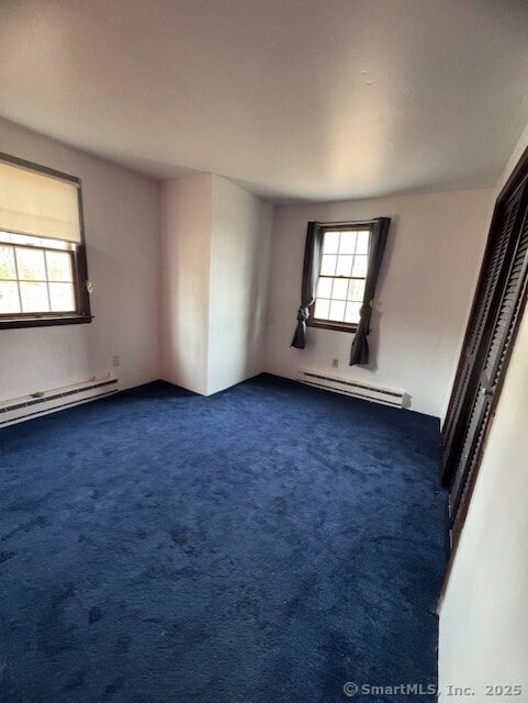 38 High St, Middlefield, CT 06455 - empty room featuring dark carpet, a baseboard heating unit, and baseboard heating