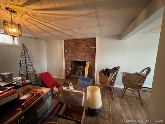 38 High St, Middlefield, CT 06455 - interior space with baseboards, wood finished floors, a drop ceiling, and baseboard heating