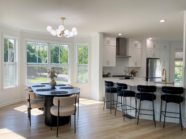dining space with baseboards and a wealth of natural light