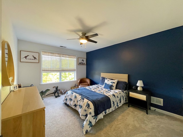 bedroom featuring ceiling fan, carpet, and visible vents