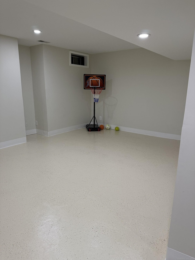 finished basement with recessed lighting and baseboards