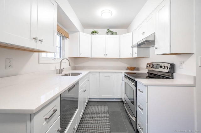 kitchen with stainless steel appliances, a sink, white cabinetry, light countertops, and under cabinet range hood