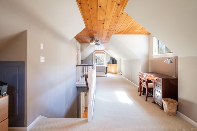 additional living space with wooden ceiling, lofted ceiling, carpet flooring, and baseboards