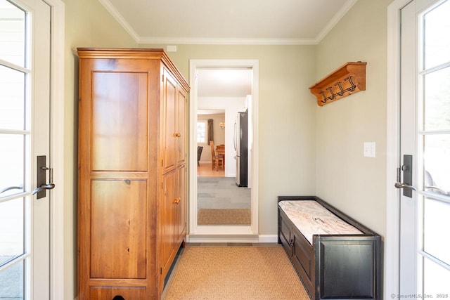 mudroom featuring baseboards and ornamental molding