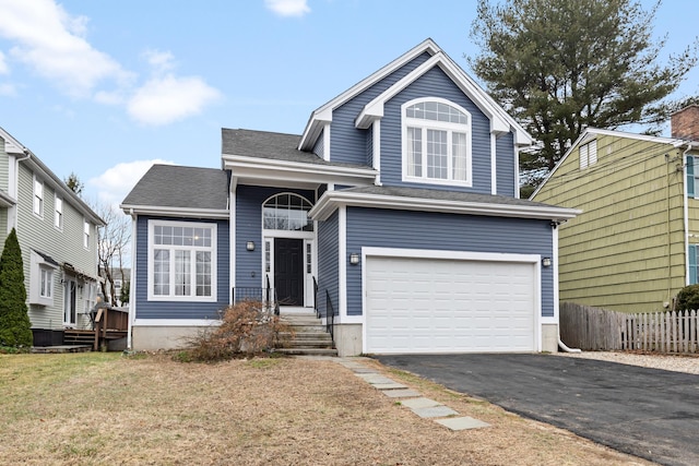 18 Catalpa St, Norwalk, CT 06851 - traditional-style home with aphalt driveway, roof with shingles, a front yard, fence, and a garage