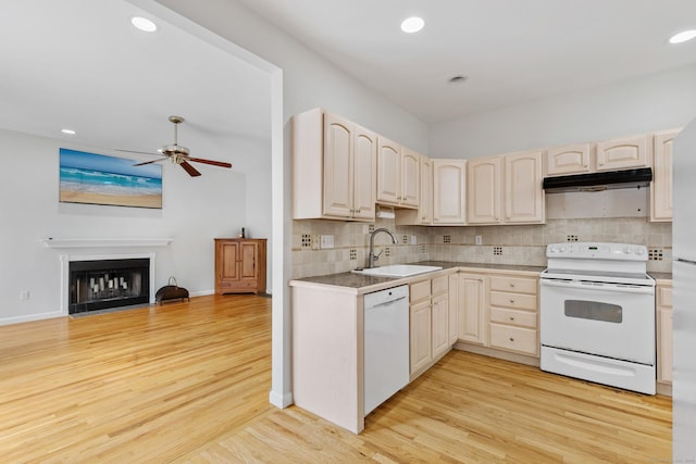 18 Catalpa St, Norwalk, CT 06851 - kitchen featuring white appliances, under cabinet range hood, ceiling fan, light wood finished floors, and a sink