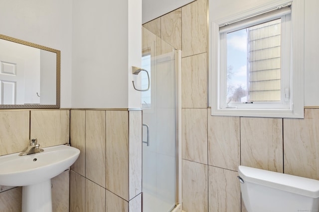 18 Catalpa St, Norwalk, CT 06851 - bathroom featuring toilet, tile walls, a stall shower, and a sink