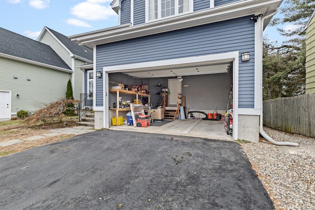 18 Catalpa St, Norwalk, CT 06851 - garage featuring driveway and fence