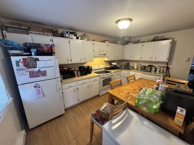519 Scott Rd Apt 60, Waterbury, CT 06705 - kitchen featuring white appliances, white cabinetry, light wood-style floors, and under cabinet range hood