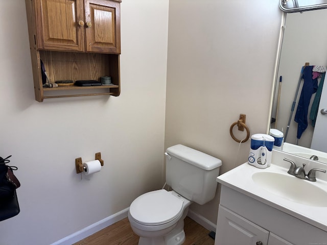 519 Scott Rd Apt 60, Waterbury, CT 06705 - half bath with baseboards, toilet, vanity, and wood finished floors