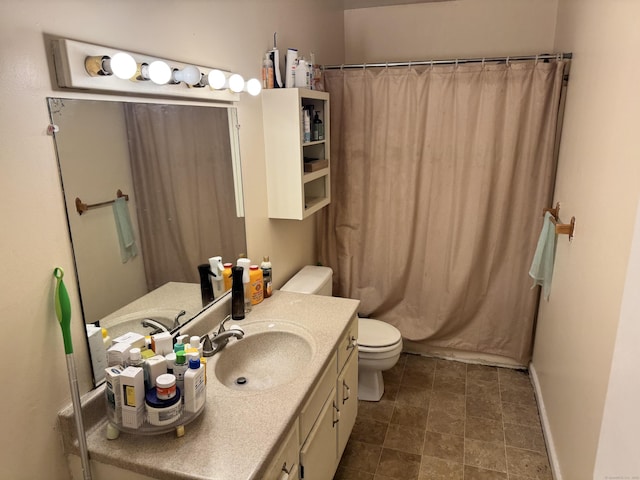 519 Scott Rd Apt 60, Waterbury, CT 06705 - bathroom featuring toilet, vanity, and baseboards