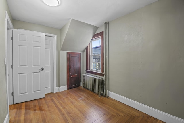 additional living space with baseboards and radiator