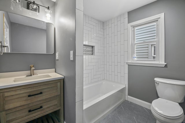 bathroom featuring toilet, baseboards, shower / tub combination, and vanity