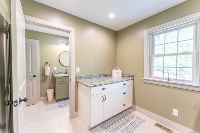bathroom with vanity, tile patterned flooring, visible vents, recessed lighting, and baseboards