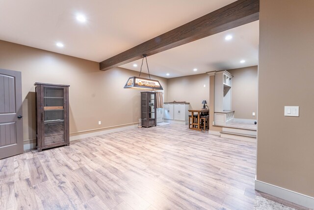 below grade area with wood finished floors, baseboards, and recessed lighting