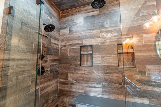 bathroom with a tile shower