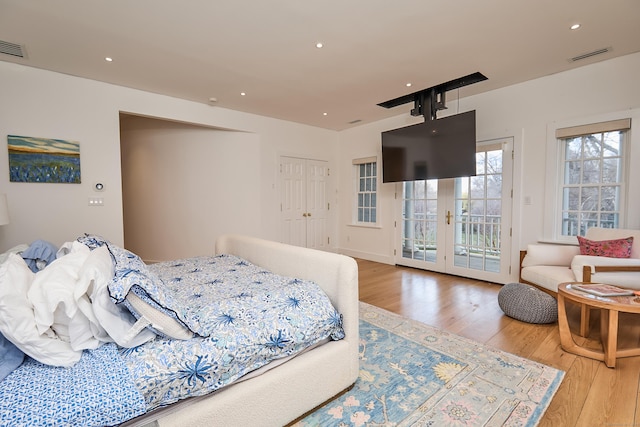 355 Greens Farms Rd, Westport, CT 06880 - bedroom with french doors, wood finished floors, visible vents, and access to exterior