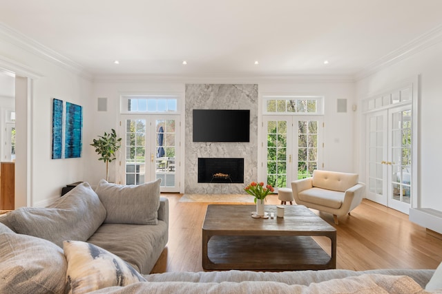 355 Greens Farms Rd, Westport, CT 06880 - living area with a premium fireplace, plenty of natural light, french doors, and wood finished floors