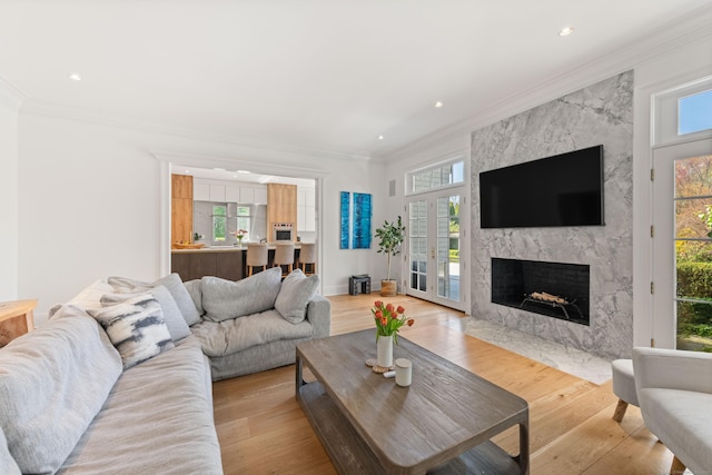 355 Greens Farms Rd, Westport, CT 06880 - living area with a high end fireplace, crown molding, recessed lighting, and a wealth of natural light