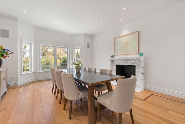 355 Greens Farms Rd, Westport, CT 06880 - dining room featuring baseboards, ornamental molding, a fireplace, and light wood-style flooring