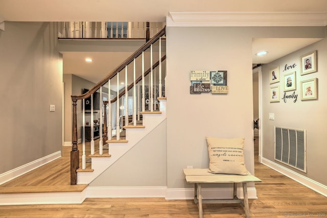 110 Far Mill Dr, Stratford, CT 06614 - staircase with crown molding, wood finished floors, baseboards, and visible vents
