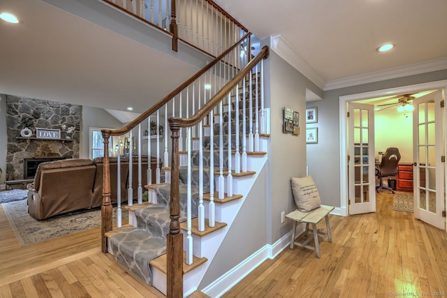 110 Far Mill Dr, Stratford, CT 06614 - stairs with baseboards, ornamental molding, french doors, ceiling fan, and hardwood / wood-style flooring