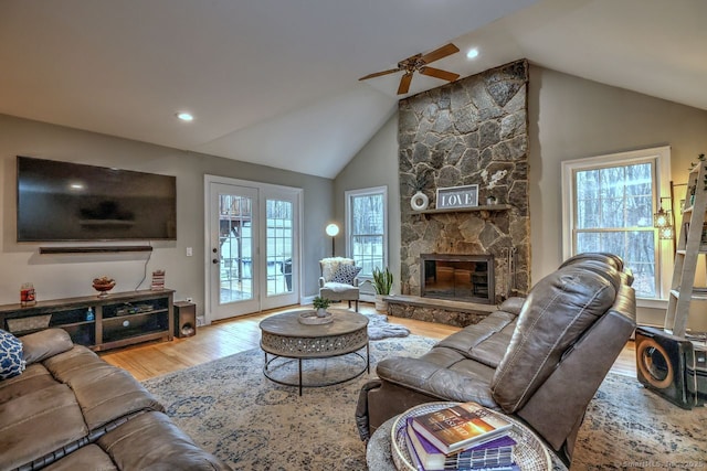 110 Far Mill Dr, Stratford, CT 06614 - living area with a wealth of natural light, lofted ceiling, wood finished floors, and ceiling fan