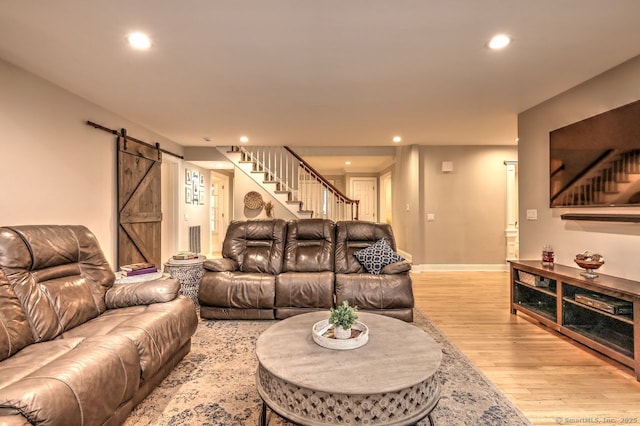 110 Far Mill Dr, Stratford, CT 06614 - living room featuring light wood-type flooring, recessed lighting, stairway, a barn door, and baseboards