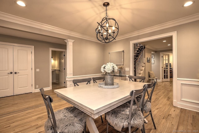110 Far Mill Dr, Stratford, CT 06614 - dining room with a chandelier, light wood-style floors, crown molding, recessed lighting, and stairs