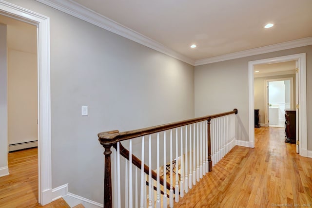 110 Far Mill Dr, Stratford, CT 06614 - corridor with light wood-style flooring, a baseboard heating unit, an upstairs landing, and recessed lighting