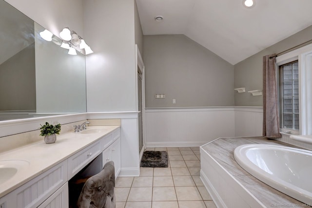 110 Far Mill Dr, Stratford, CT 06614 - bathroom featuring a bath, a wainscoted wall, a sink, lofted ceiling, and tile patterned floors