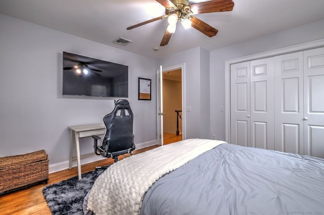 110 Far Mill Dr, Stratford, CT 06614 - bedroom with visible vents, baseboards, a closet, a ceiling fan, and wood finished floors