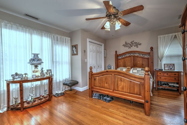 110 Far Mill Dr, Stratford, CT 06614 - bedroom with visible vents, baseboards, a closet, a ceiling fan, and light wood finished floors