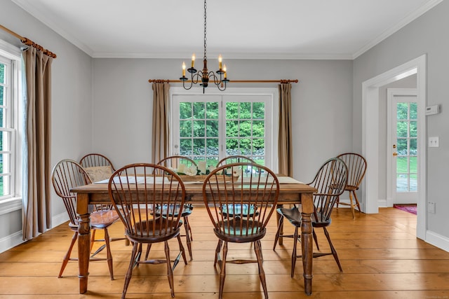 6 Ely Ln, Killingworth, CT 06419 - dining room with a chandelier, light wood finished floors, crown molding, and baseboards