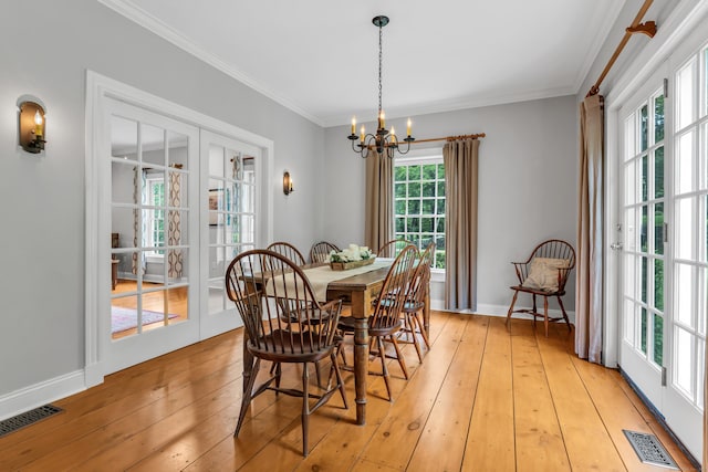 6 Ely Ln, Killingworth, CT 06419 - dining room with a chandelier, crown molding, light wood finished floors, and baseboards