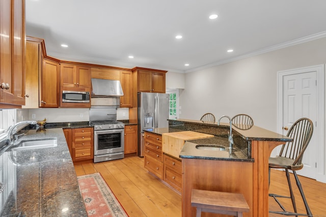 6 Ely Ln, Killingworth, CT 06419 - kitchen featuring stainless steel appliances, exhaust hood, a sink, crown molding, and a breakfast bar area