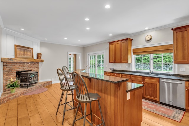 6 Ely Ln, Killingworth, CT 06419 - kitchen with dishwasher, a sink, light wood-type flooring, a kitchen bar, and healthy amount of natural light