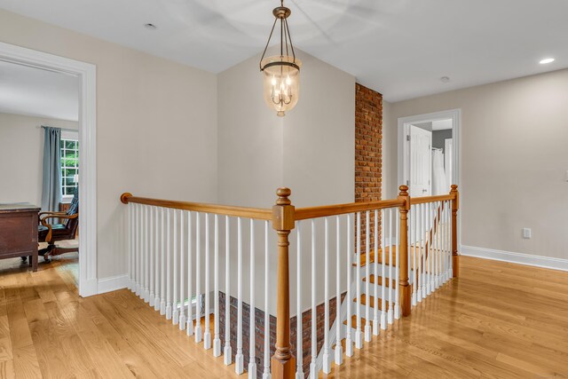 6 Ely Ln, Killingworth, CT 06419 - hall featuring an upstairs landing, wood finished floors, baseboards, and recessed lighting