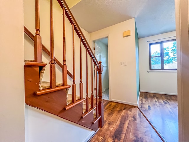 1516 E Main St Apt 18, Meriden, CT 06450 - stairway featuring wood finished floors and baseboards
