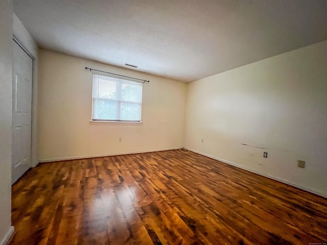1516 E Main St Apt 18, Meriden, CT 06450 - unfurnished bedroom featuring wood finished floors and baseboards
