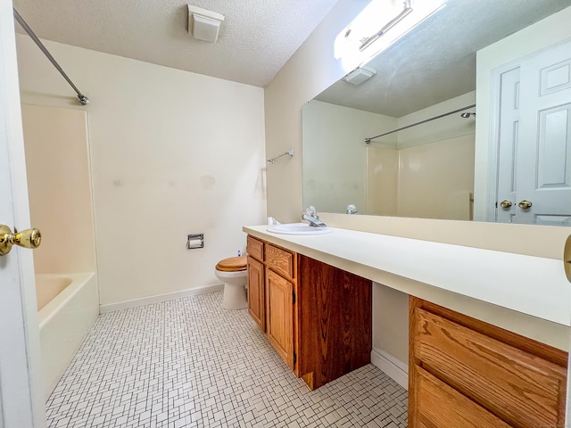 1516 E Main St Apt 18, Meriden, CT 06450 - bathroom with vanity, toilet, tub / shower combination, baseboards, and a textured ceiling
