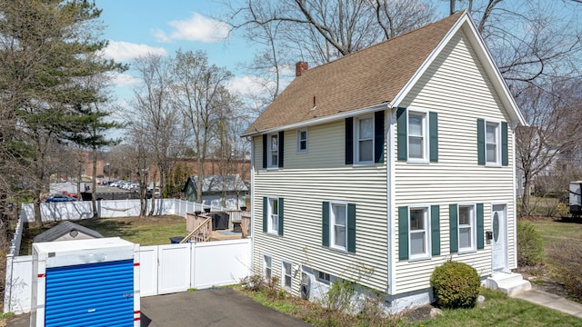 188 Meadow St, Branford, CT 06405 - view of side of property featuring a shingled roof, fence, a chimney, and a gate