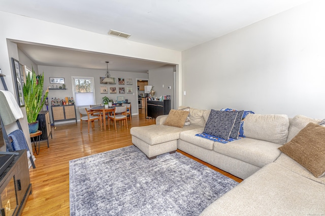 188 Meadow St, Branford, CT 06405 - living area featuring light wood finished floors and visible vents