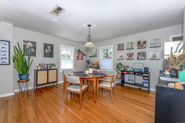 188 Meadow St, Branford, CT 06405 - dining room with light wood-type flooring, baseboards, and visible vents