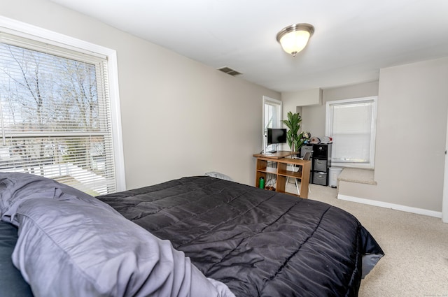188 Meadow St, Branford, CT 06405 - carpeted bedroom featuring visible vents, baseboards, and multiple windows