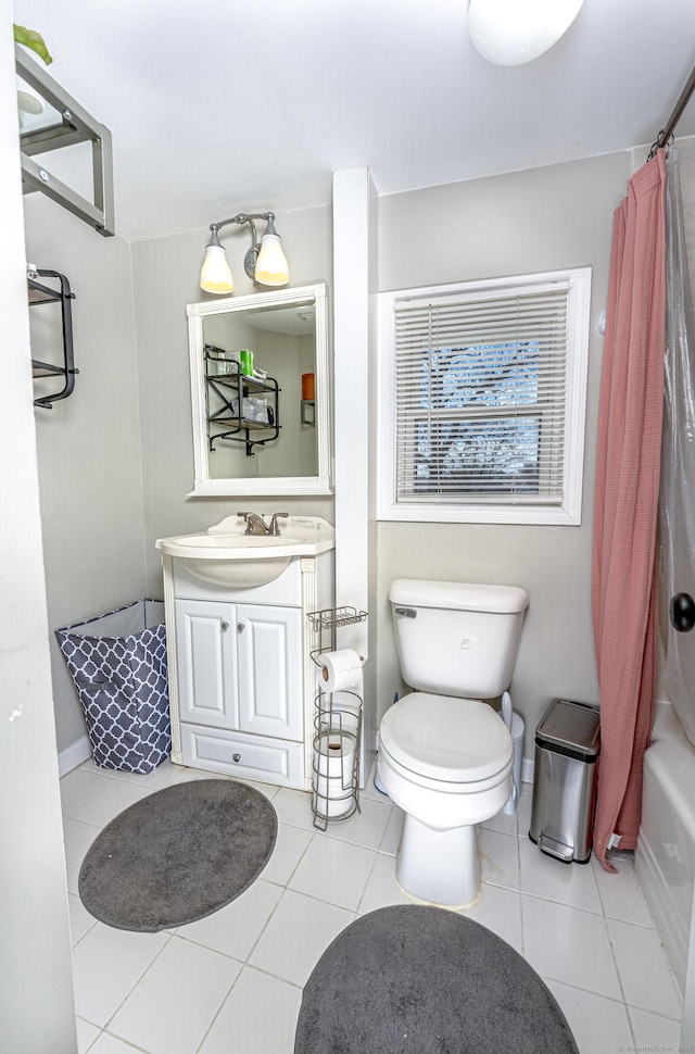 188 Meadow St, Branford, CT 06405 - bathroom featuring vanity, tile patterned flooring, toilet, shower / bath combo, and baseboards