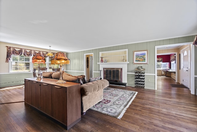 15 Maple Ln, Brookfield, CT 06804 - living room with crown molding, a glass covered fireplace, a baseboard radiator, and dark wood finished floors