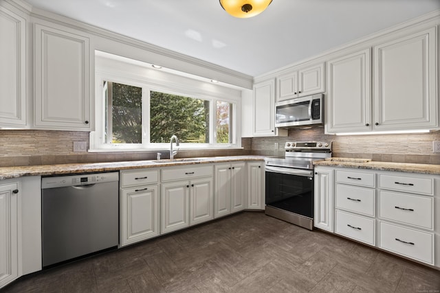 15 Maple Ln, Brookfield, CT 06804 - kitchen with white cabinets, appliances with stainless steel finishes, decorative backsplash, and a sink