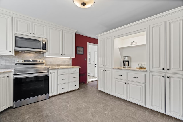 15 Maple Ln, Brookfield, CT 06804 - kitchen featuring appliances with stainless steel finishes, light stone counters, decorative backsplash, and white cabinets